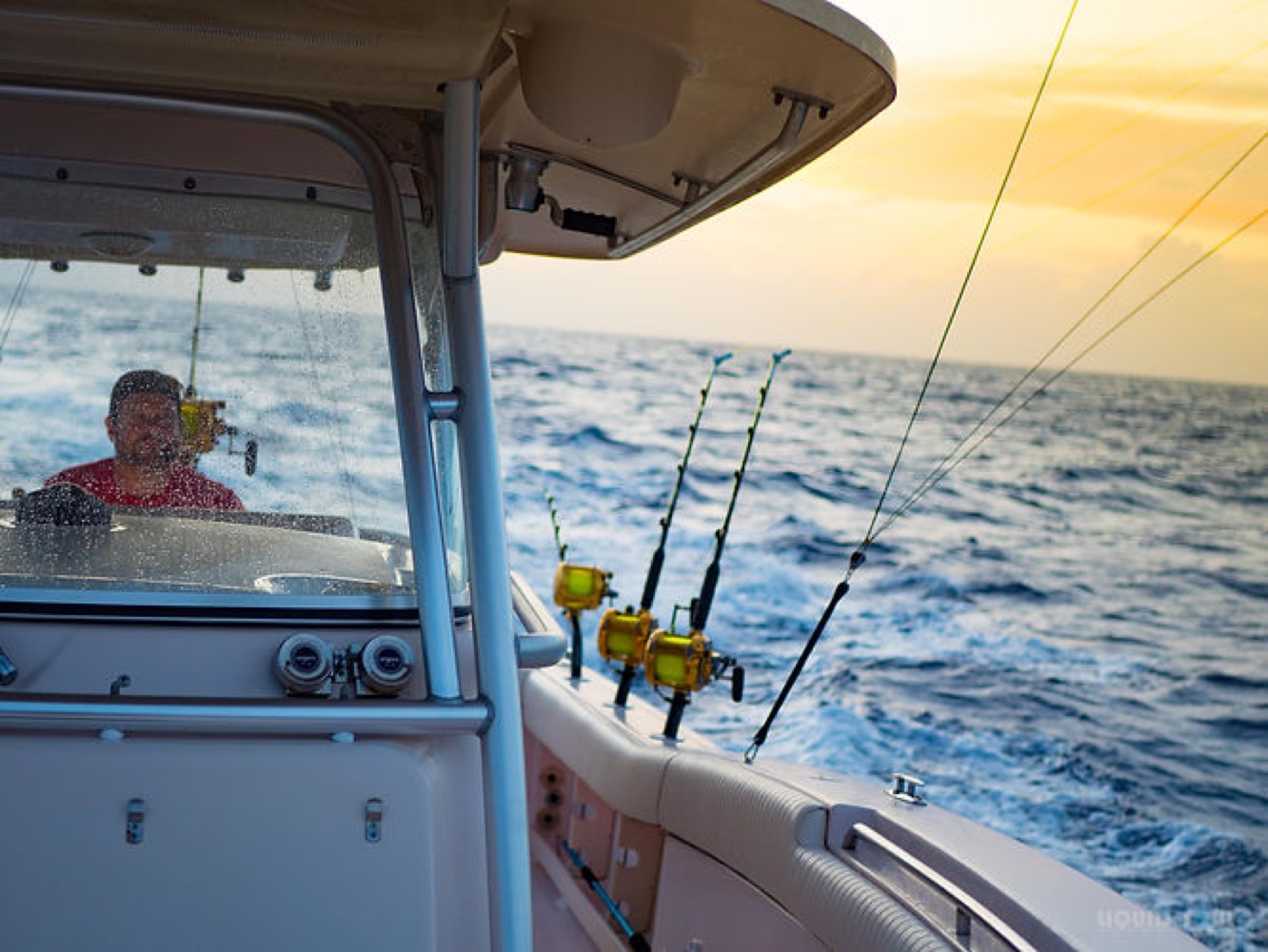 Anglers fishing at sunset off Guam